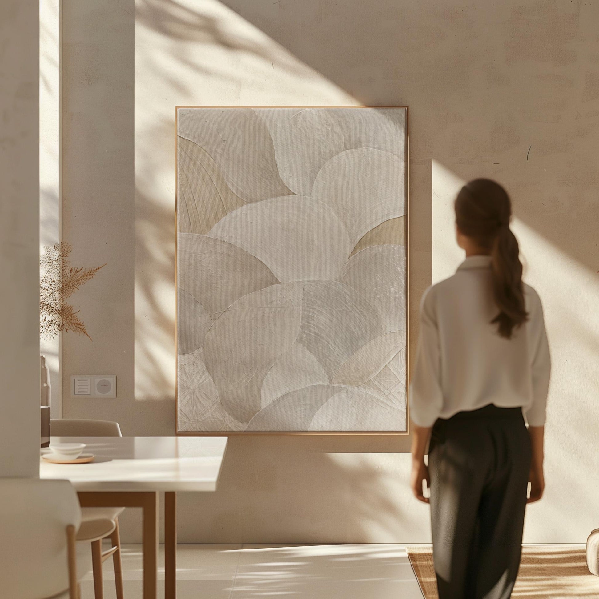 Sweeping layered petal curves in cream tones, canvas print presented in a light, minimal room