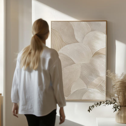 Sweeping layered petal curves in cream tones, canvas wall art on a quiet wall in a considered interior