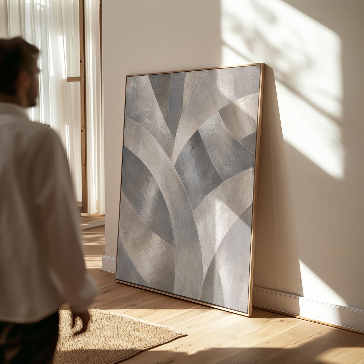Crossing curved silver bands in graceful motion, canvas print seen in a warm interior with natural light