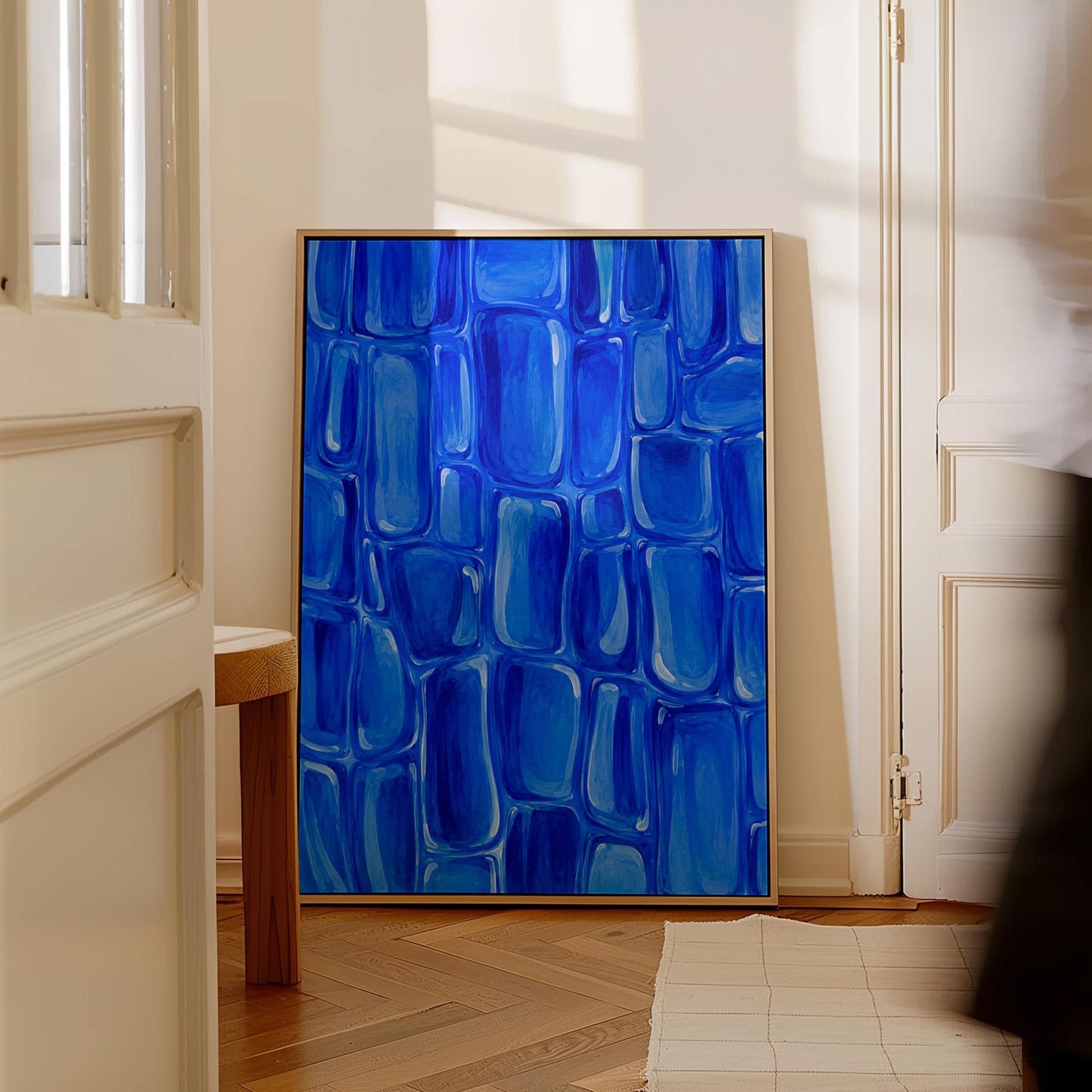 Bold cobalt brush stroke blocks in painterly rows, canvas print shown to scale in a furnished room