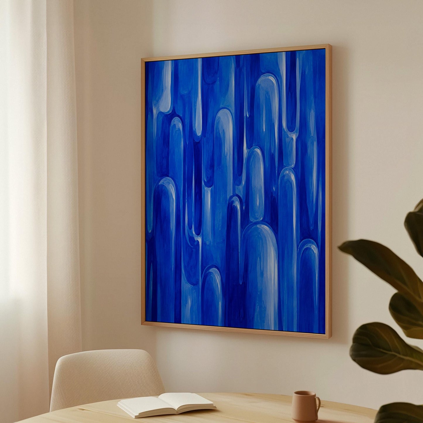 Vertical cobalt streaks like flowing rain, canvas wall art seen in a warm interior with natural light