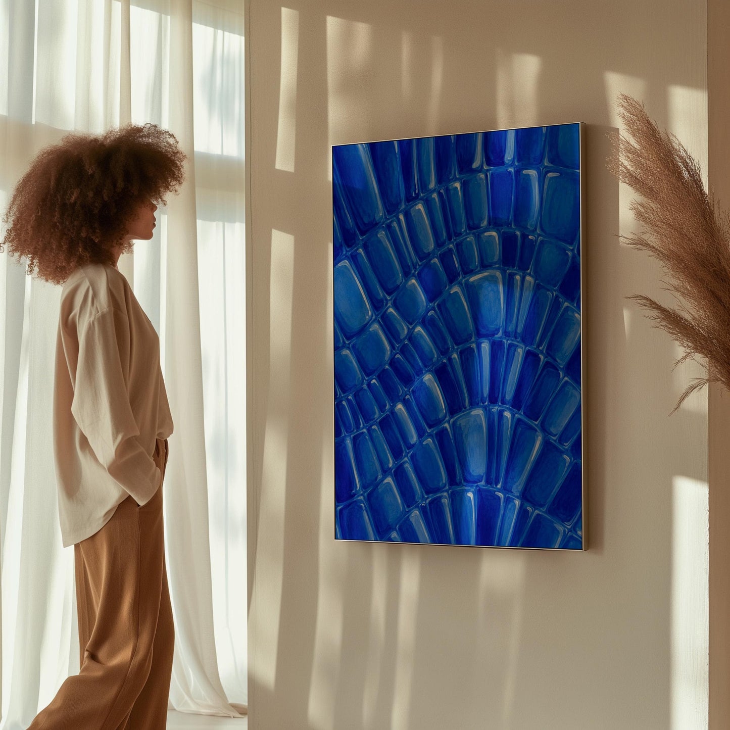 Fan arcs of cobalt mosaic pebbles, canvas print styled against a soft white wall