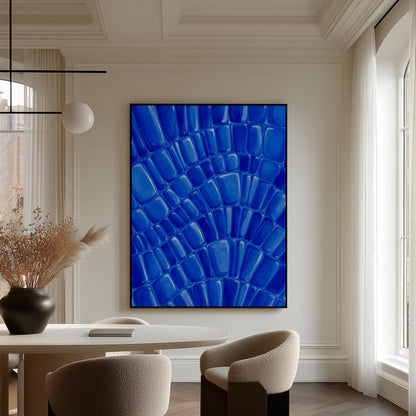 Fan arcs of cobalt mosaic pebbles, canvas wall art on a quiet wall in a considered interior