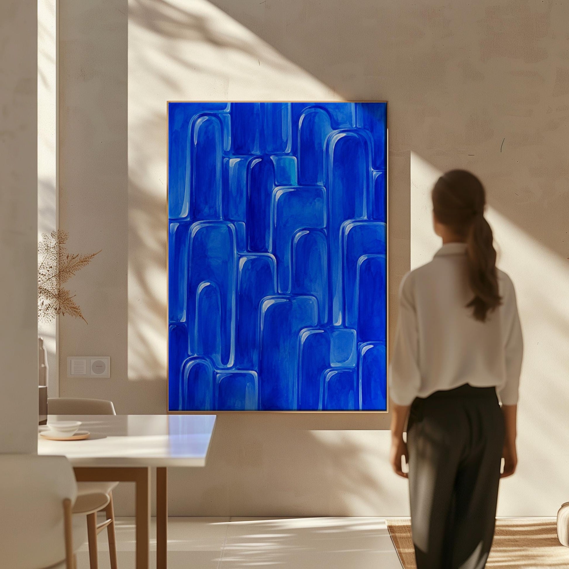 Rounded arch tile shapes in vivid cobalt blue, canvas print styled against a soft white wall