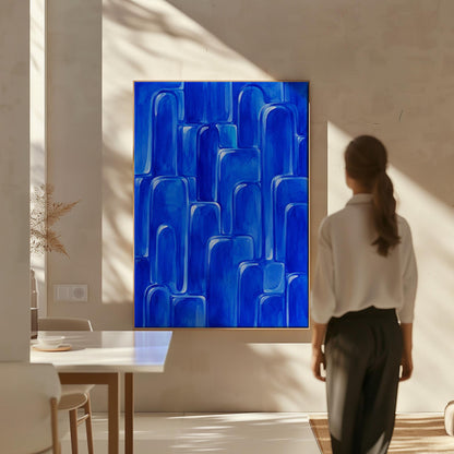 Rounded arch tile shapes in vivid cobalt blue, canvas print styled against a soft white wall