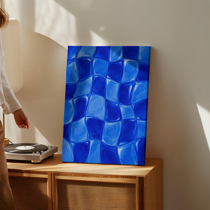 Wavy checkered squares in deep cobalt blue, canvas wall art presented in a light, minimal room