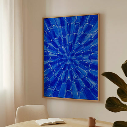 Radial starburst rays in electric cobalt blue, canvas wall art on a quiet wall in a considered interior