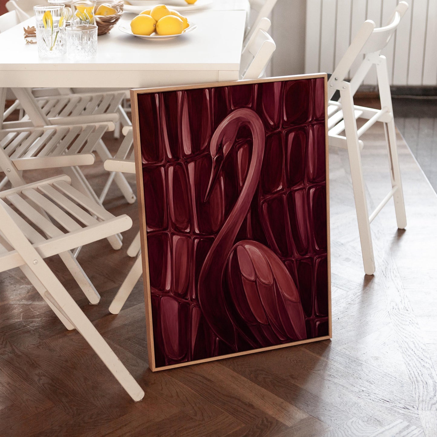 Flamingo silhouette emerging from deep burgundy, canvas wall art on a quiet wall in a considered interior