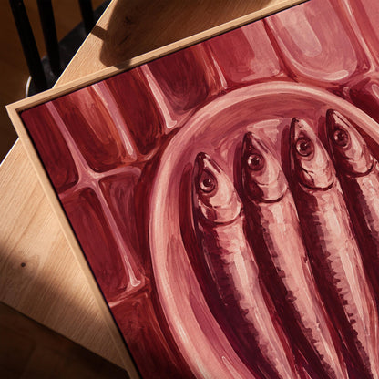 Sardines on oval platter in burgundy monochrome, canvas print in a warm, minimally styled interior
