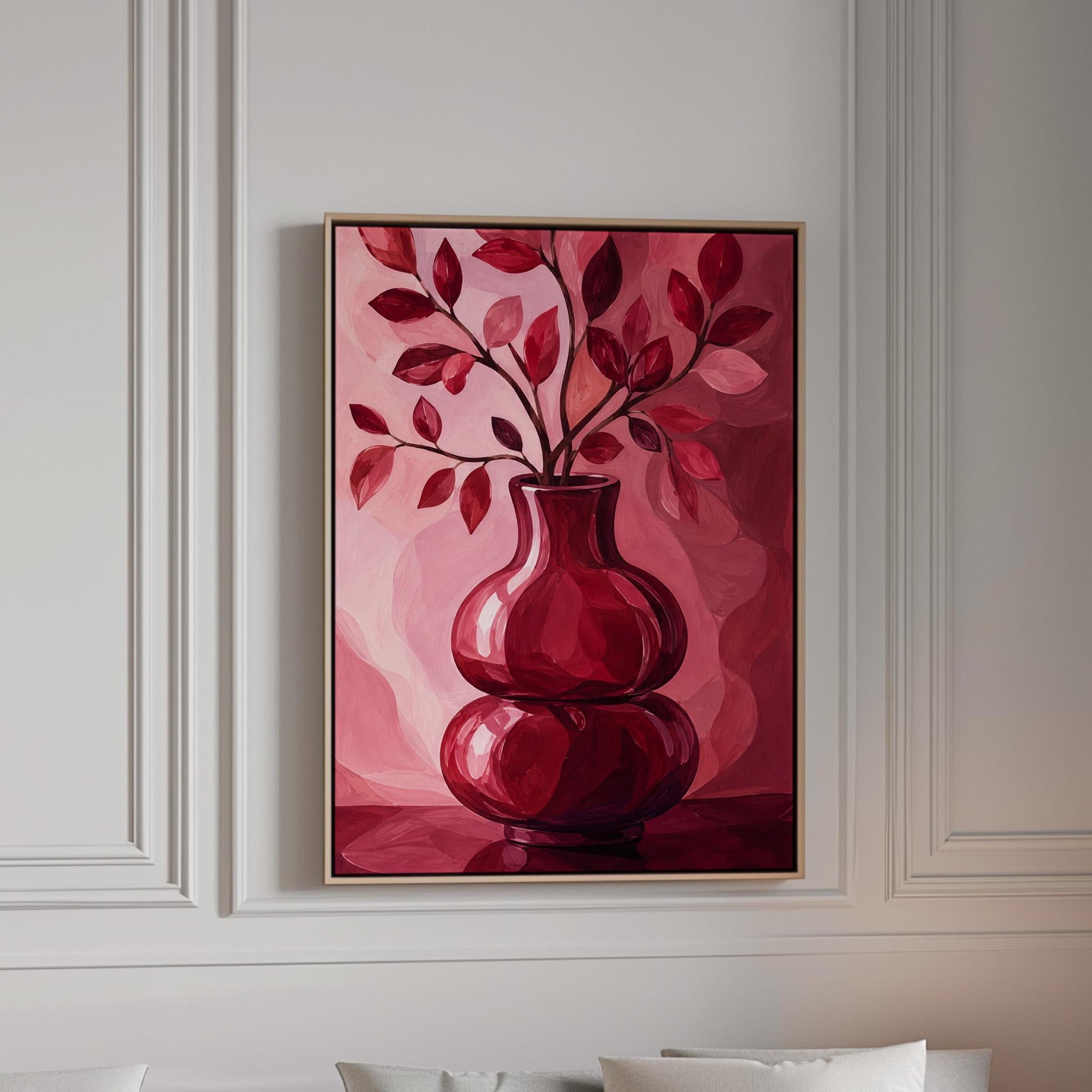 Curvy red vase with leafy branch in burgundy tones, canvas print in a bright room with natural daylight