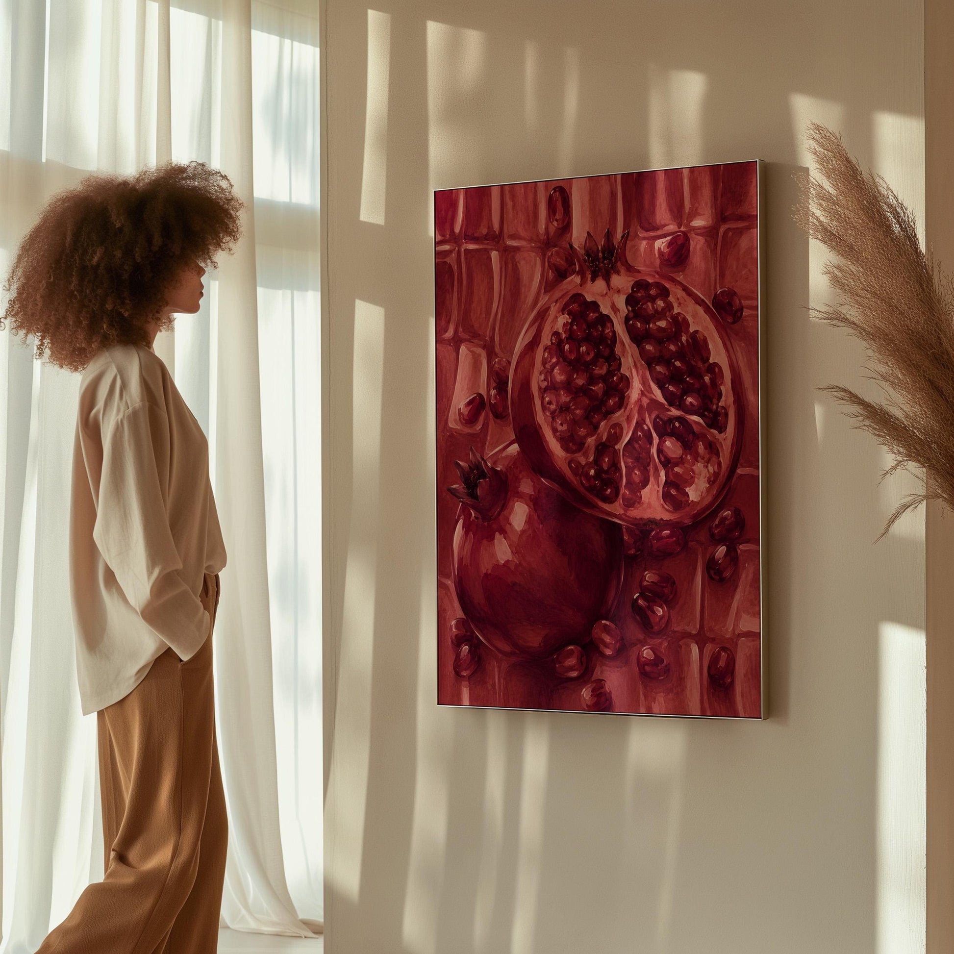 Open pomegranate with ruby seeds in burgundy tones, canvas print seen in a warm interior with natural light