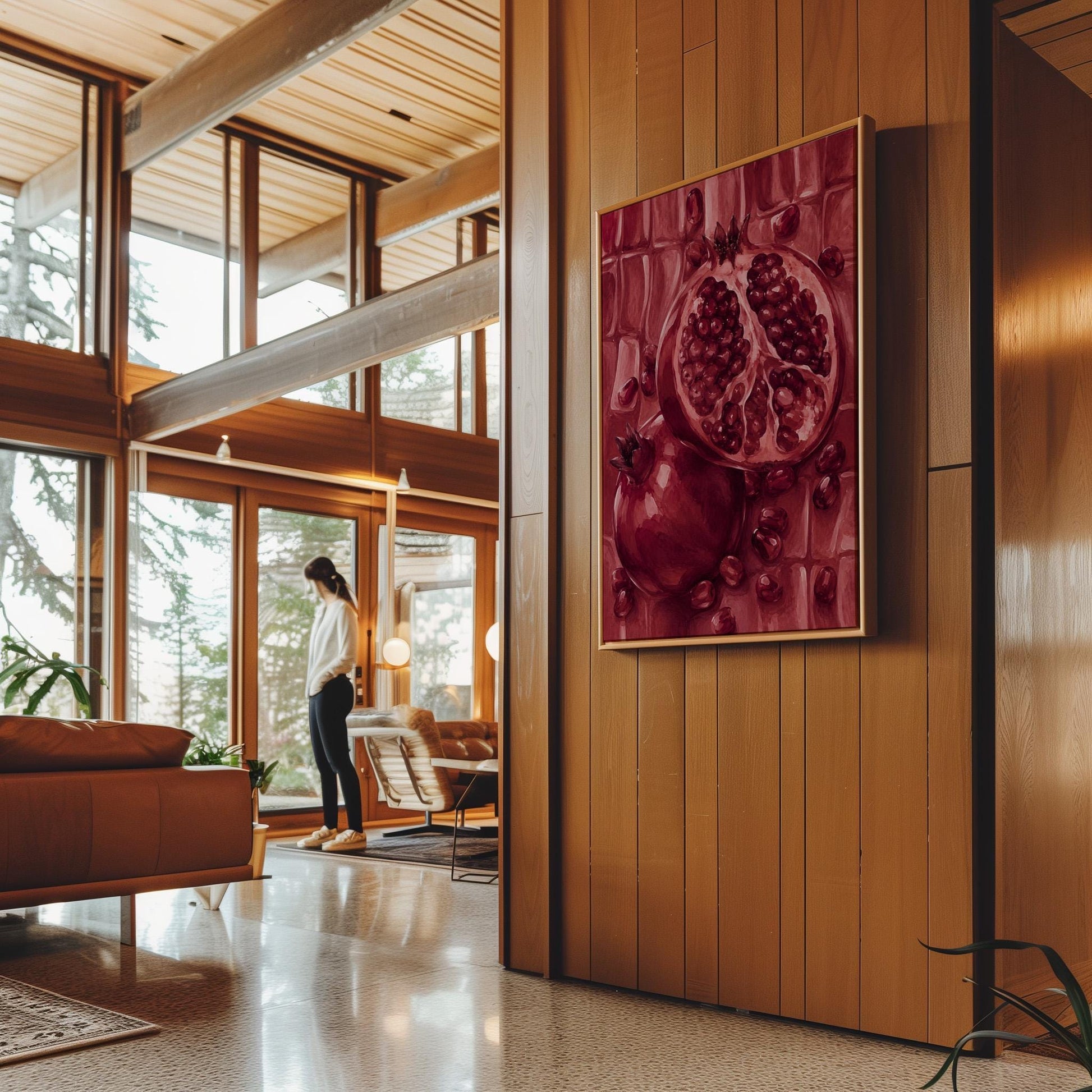 Open pomegranate with ruby seeds in burgundy tones, canvas print on a quiet wall in a considered interior