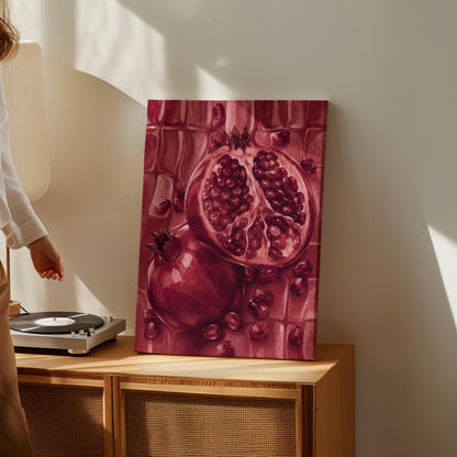 Open pomegranate with ruby seeds in burgundy tones, canvas print shown in a sunlit, contemporary room