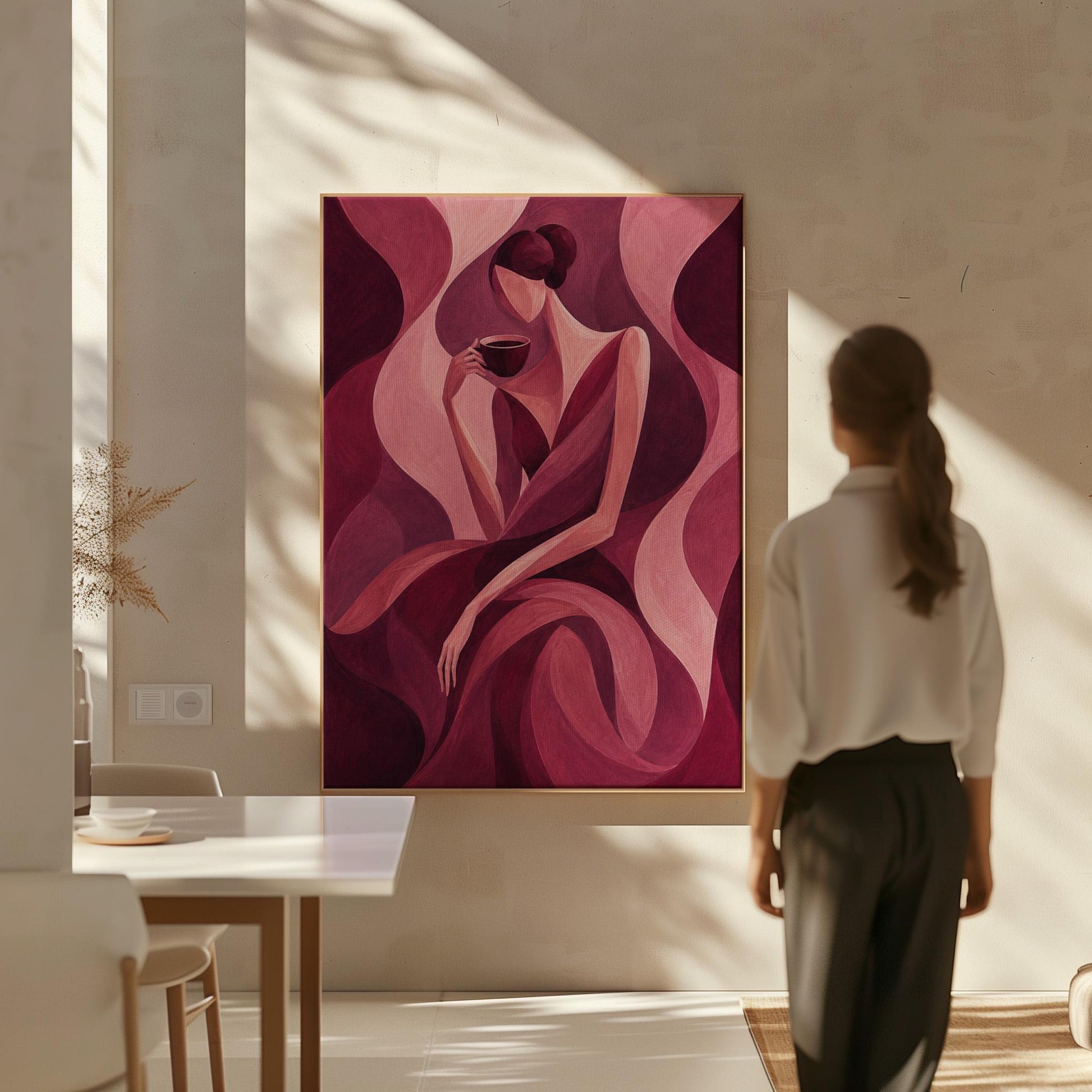Woman sipping coffee among soft burgundy waves, canvas print seen in a warm interior with natural light