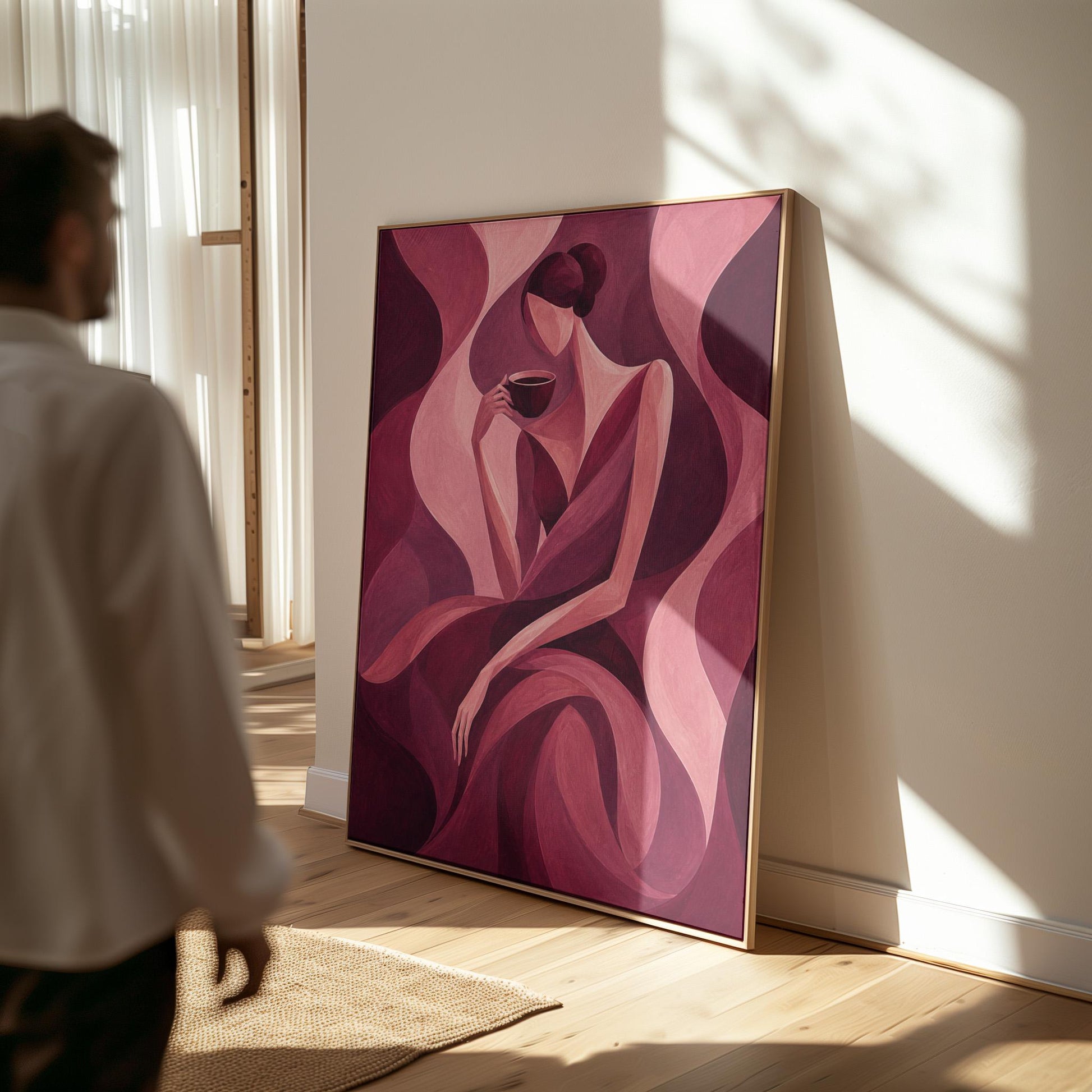 Woman sipping coffee among soft burgundy waves, canvas wall art seen in a warm interior with natural light