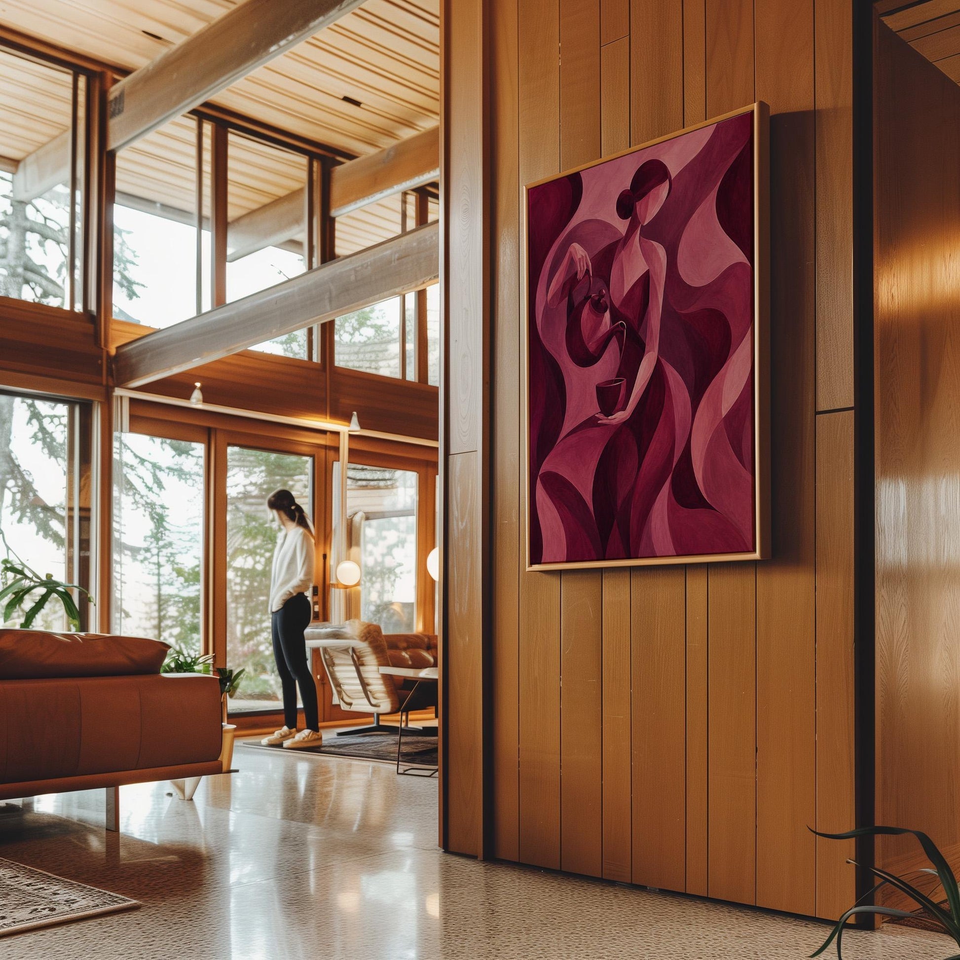 Woman pouring tea in flowing burgundy deco style, canvas wall art hanging in a calm, modern living space