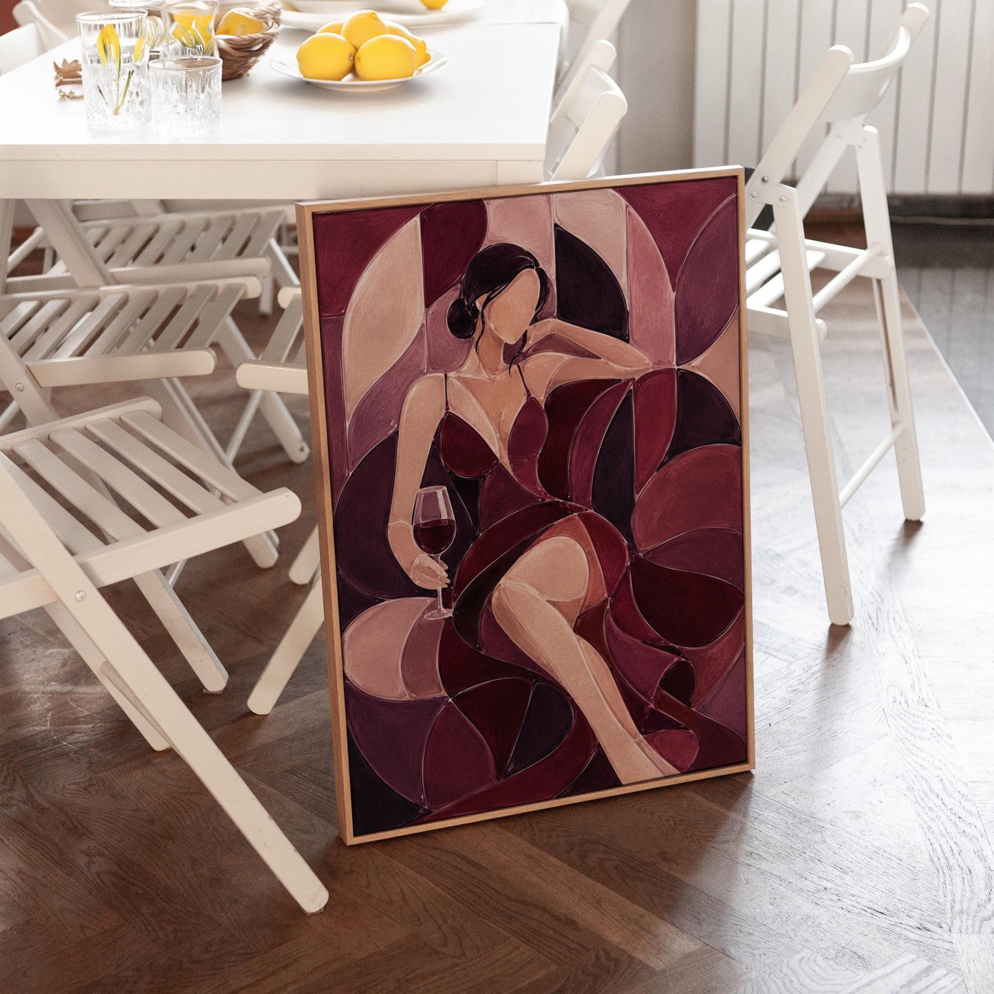 Woman lounging with wine glass in burgundy deco, canvas print shown in a sunlit, contemporary room