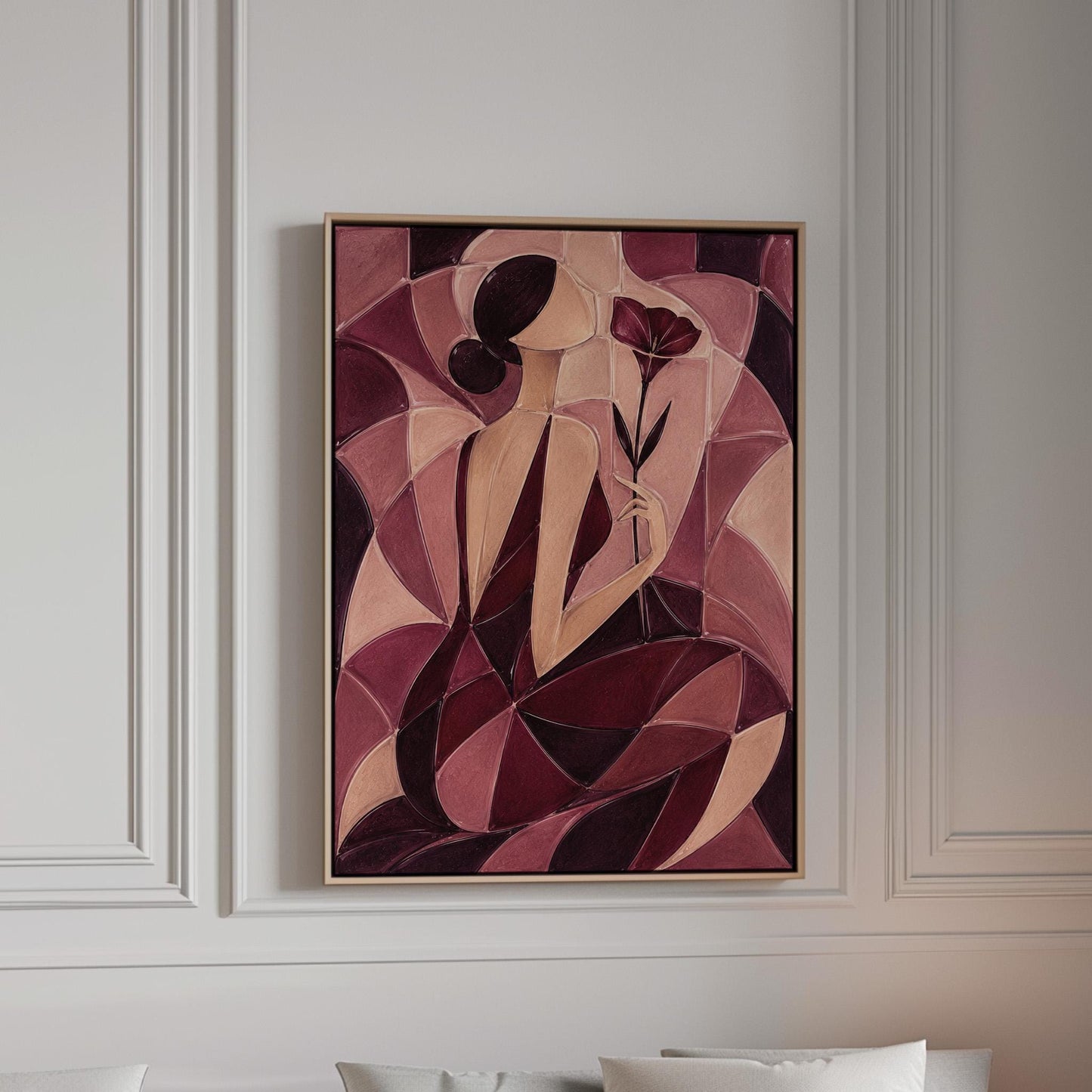 Woman holding poppies in cubist burgundy and cream, canvas print in a bright room with natural daylight