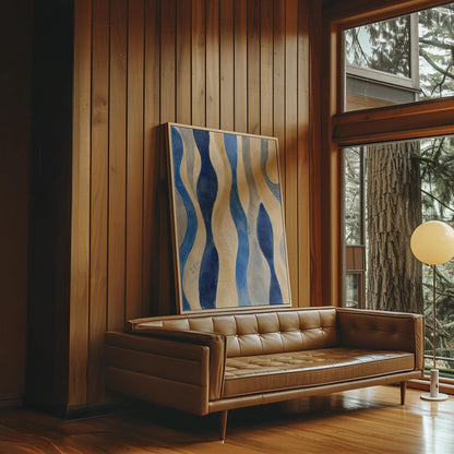 Vertical flowing wave bands in indigo and cream, canvas print hanging in a calm, modern living space