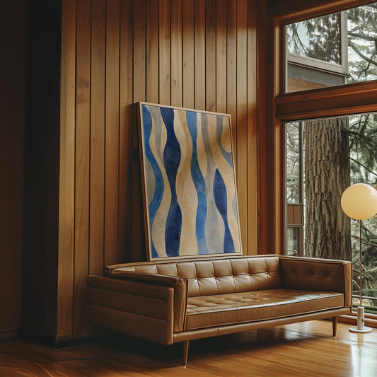 Vertical flowing wave bands in indigo and cream, canvas print hanging in a calm, modern living space