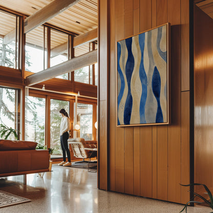 Vertical flowing wave bands in indigo and cream, canvas print shown to scale in a furnished room