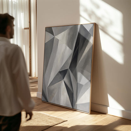 Angular graphite planes with sharp light play, canvas print seen in a warm interior with natural light