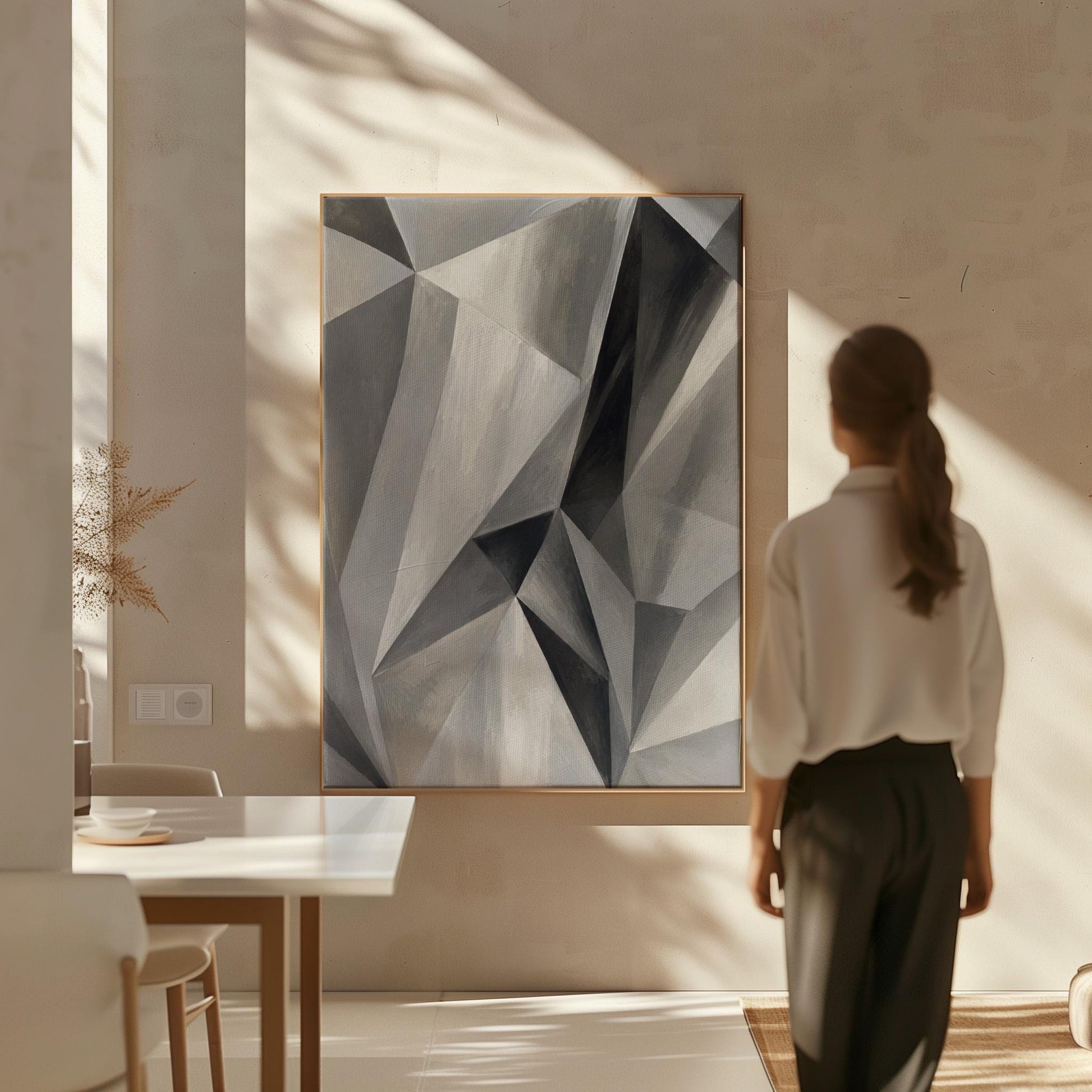Angular graphite planes with sharp light play, canvas print on a quiet wall in a considered interior