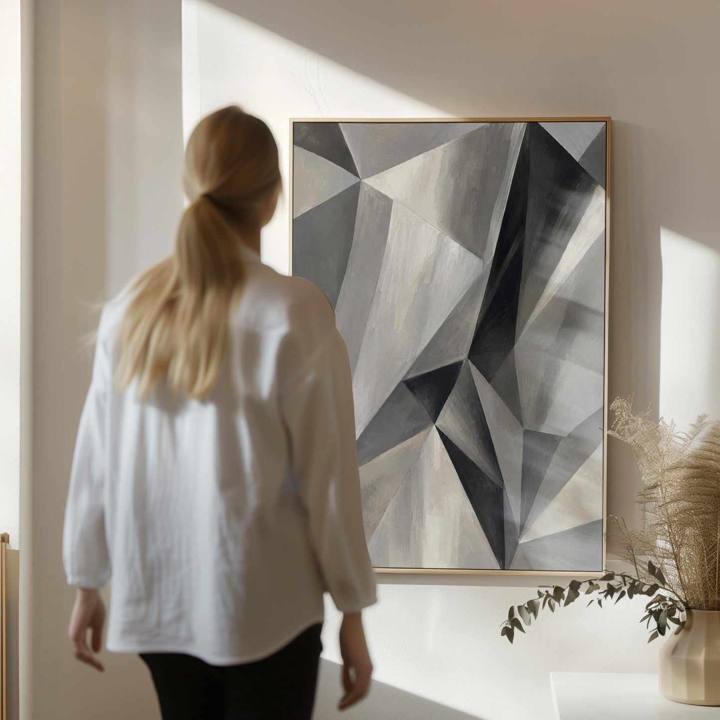 Angular graphite planes with sharp light play, canvas wall art styled against a soft white wall