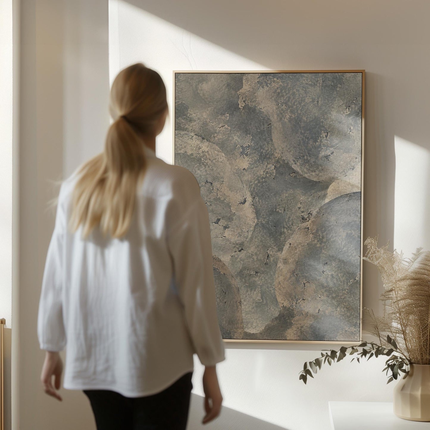 Layered misty gray cloud forms, canvas print presented in a light, minimal room
