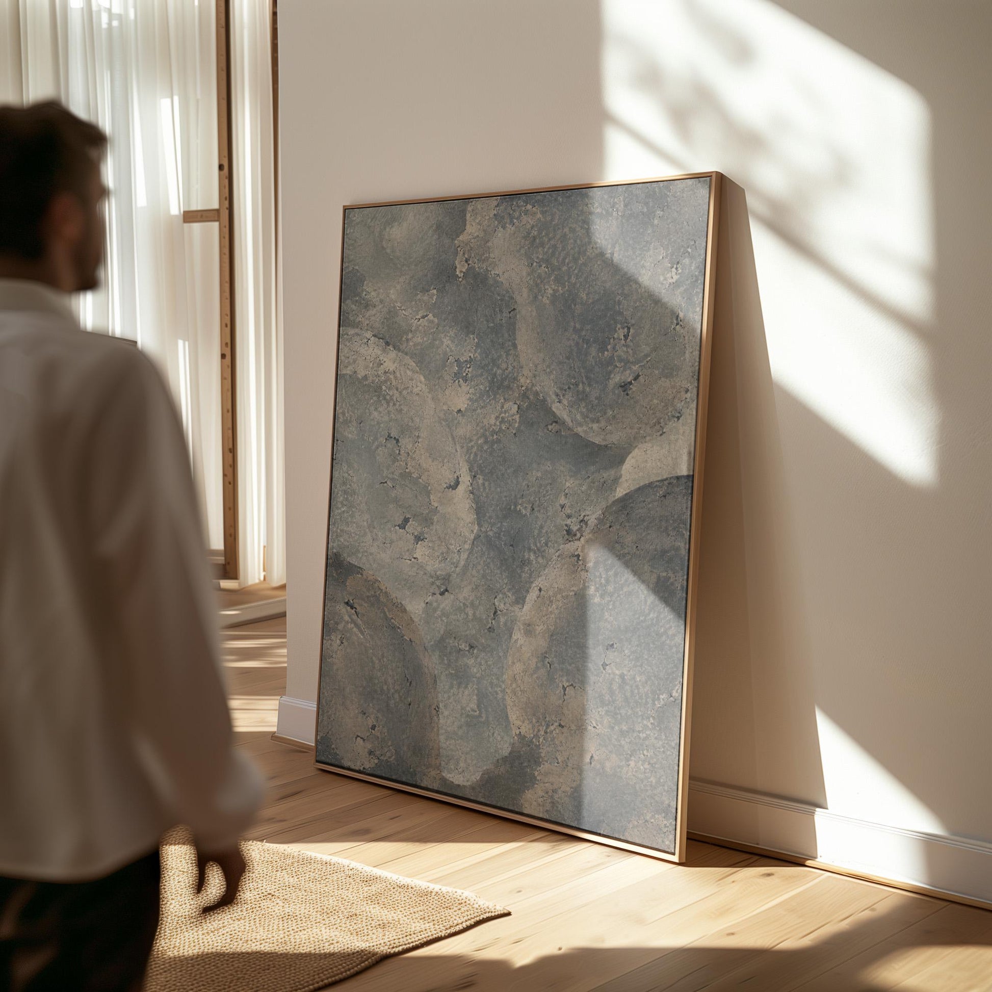 Layered misty gray cloud forms, canvas wall art presented in a light, minimal room