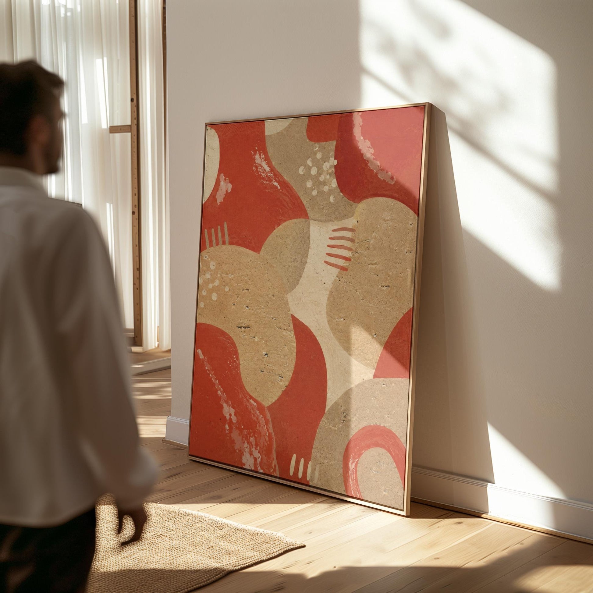 Interlocking terracotta and beige organic shapes, canvas print displayed on a neutral wall in a styled interior