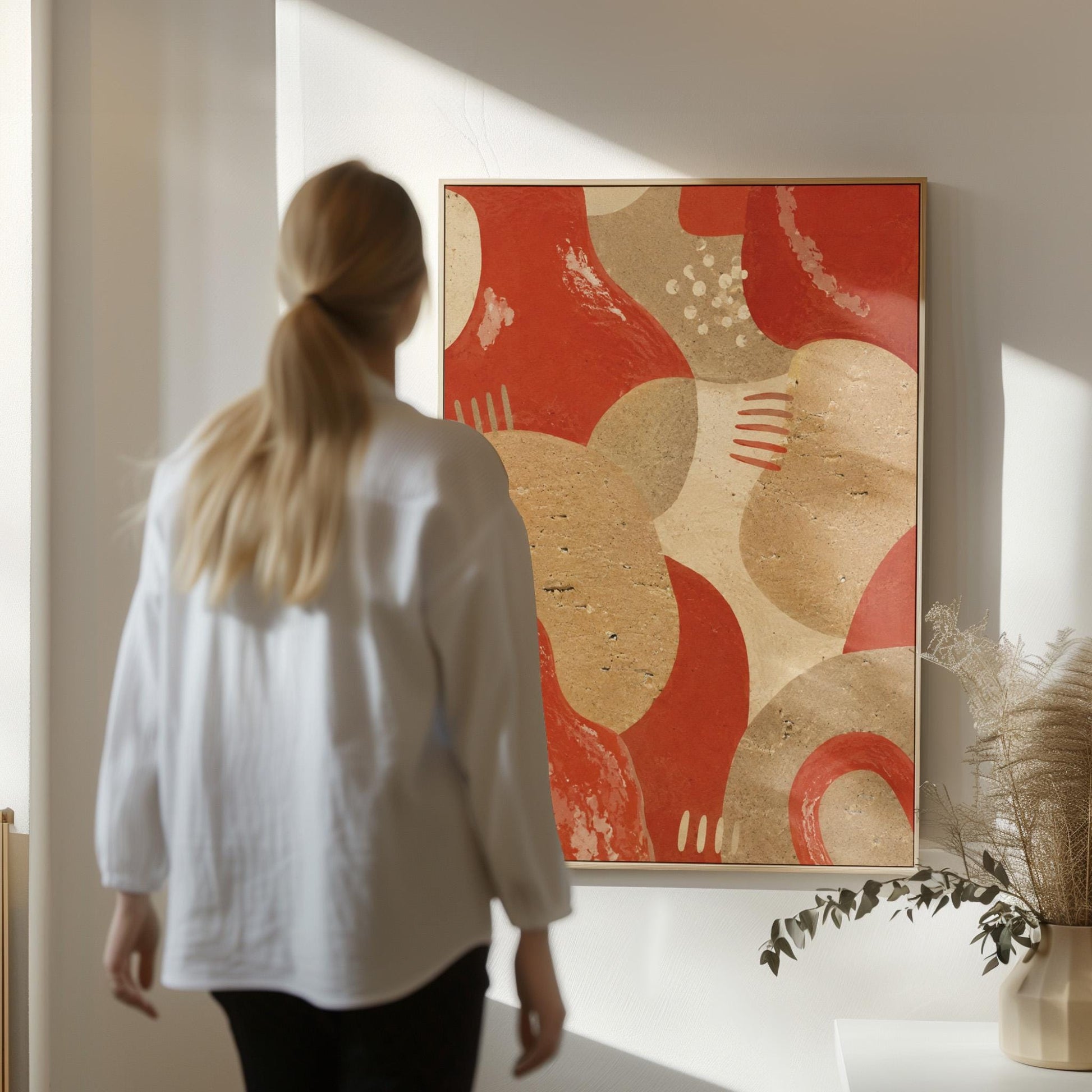 Interlocking terracotta and beige organic shapes, canvas print on a quiet wall in a considered interior