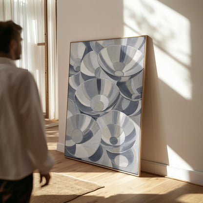 Nested silver bowl curves overlapping rhythmically, canvas print displayed on a neutral wall in a styled interior
