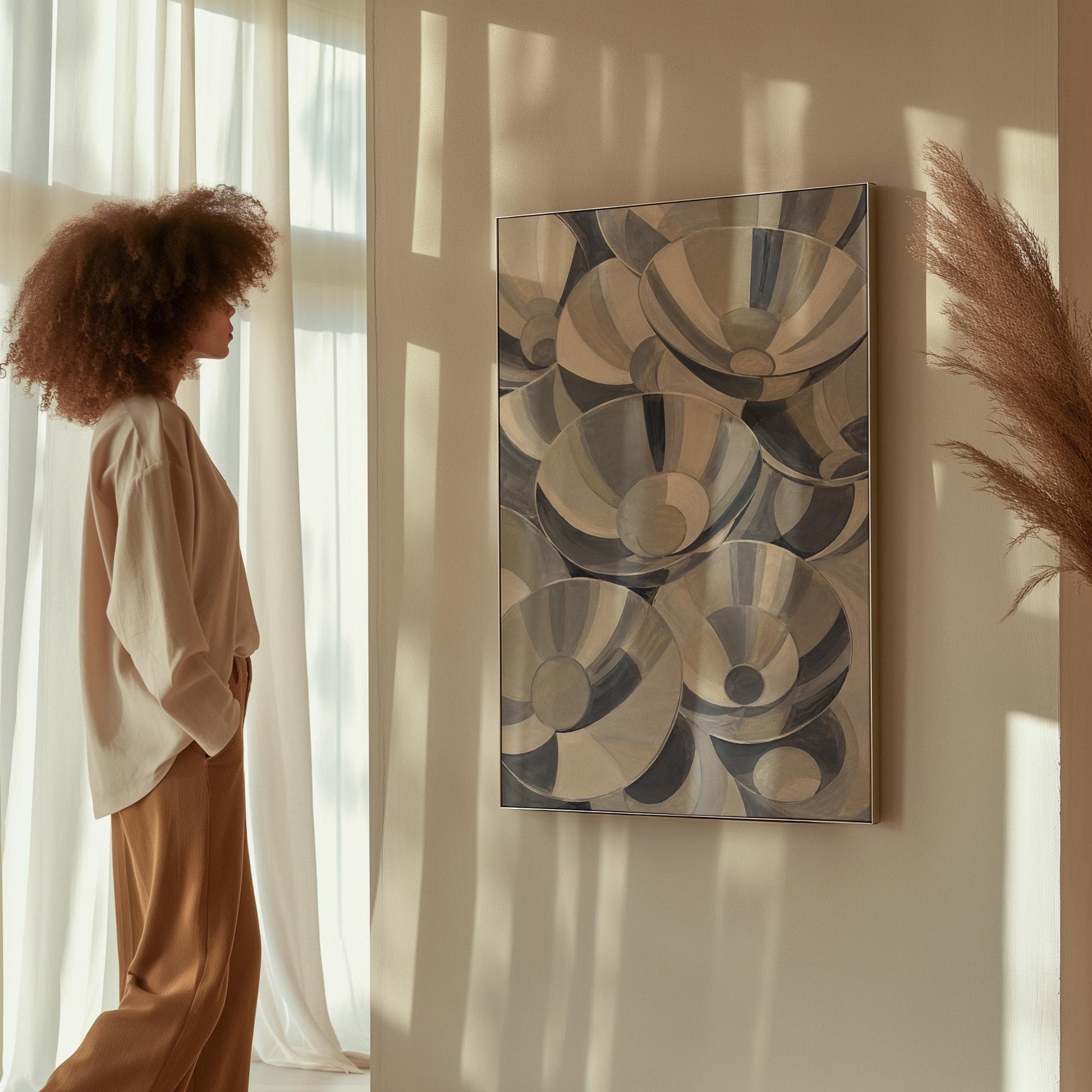 Nested silver bowl curves overlapping rhythmically, canvas print shown in a sunlit, contemporary room