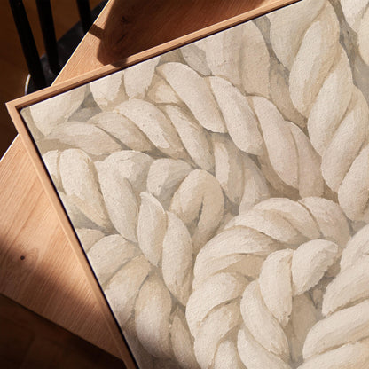 Thick cream ropes twisted into a knot, canvas print in a warm, minimally styled interior
