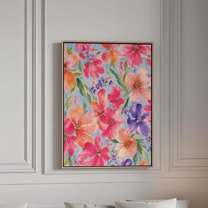 Vivid pink and purple watercolor blooms on light blue, canvas print in a bright room with natural daylight