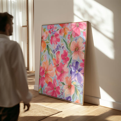 Vivid pink and purple watercolor blooms on light blue, canvas print presented in a light, minimal room
