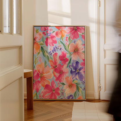 Vivid pink and purple watercolor blooms on light blue, canvas print on a quiet wall in a considered interior