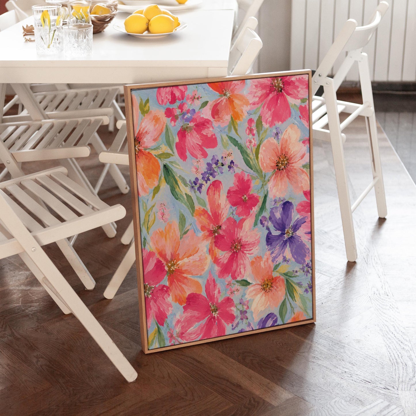 Vivid pink and purple watercolor blooms on light blue, canvas wall art hanging in a calm, modern living space