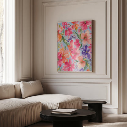 Vivid pink and purple watercolor blooms on light blue, canvas wall art on a quiet wall in a considered interior