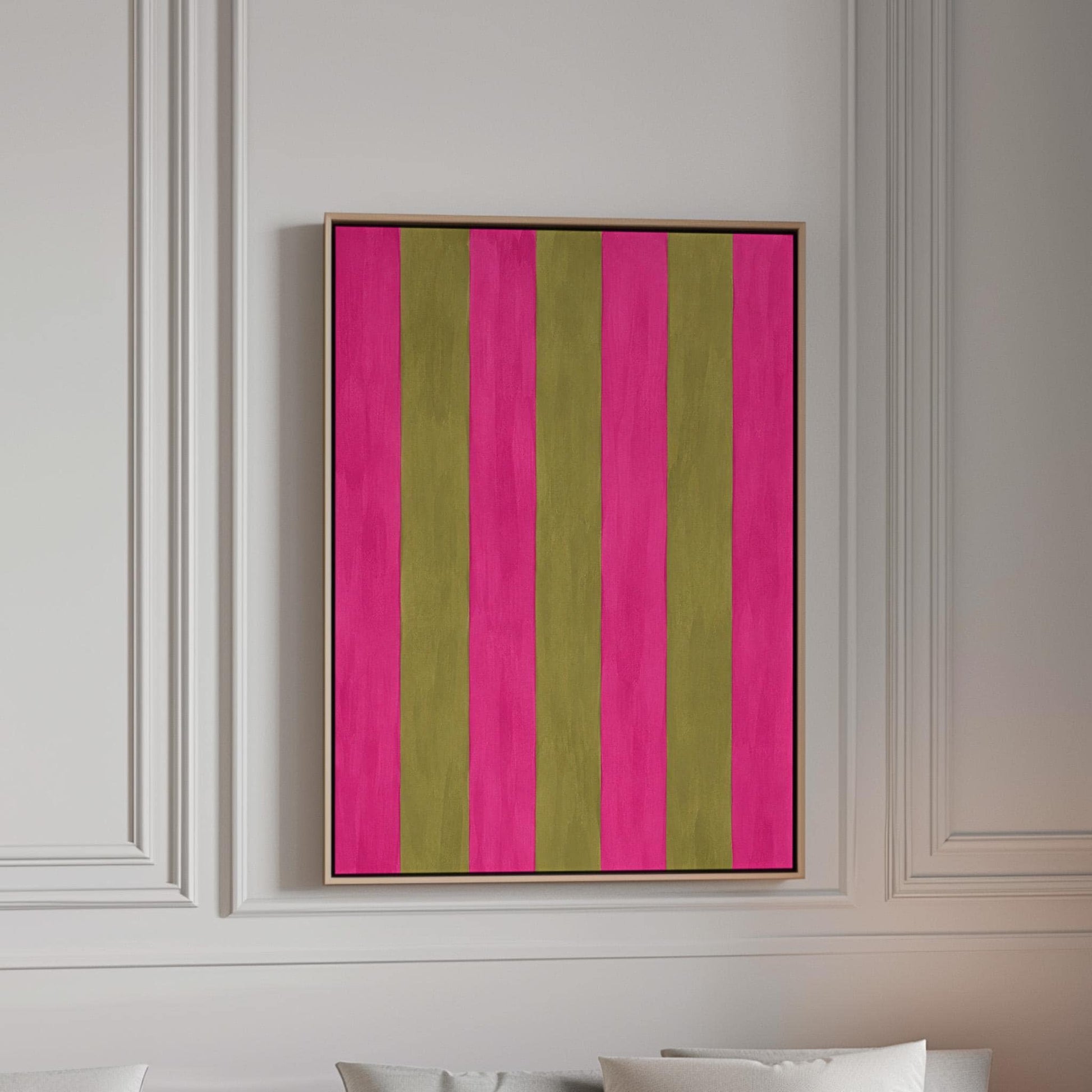 Bold vertical stripes in hot pink and olive green, canvas print in a bright room with natural daylight