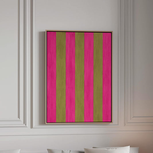Bold vertical stripes in hot pink and olive green, canvas print in a bright room with natural daylight
