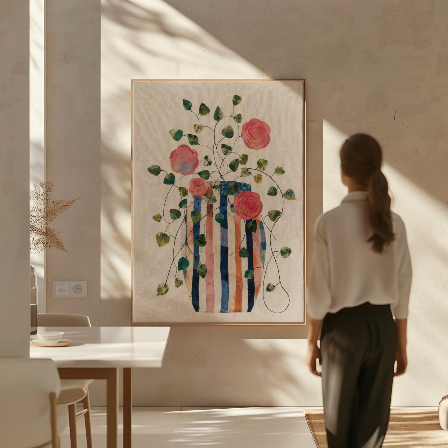 Climbing roses around a striped collage vase, canvas wall art on a quiet wall in a considered interior