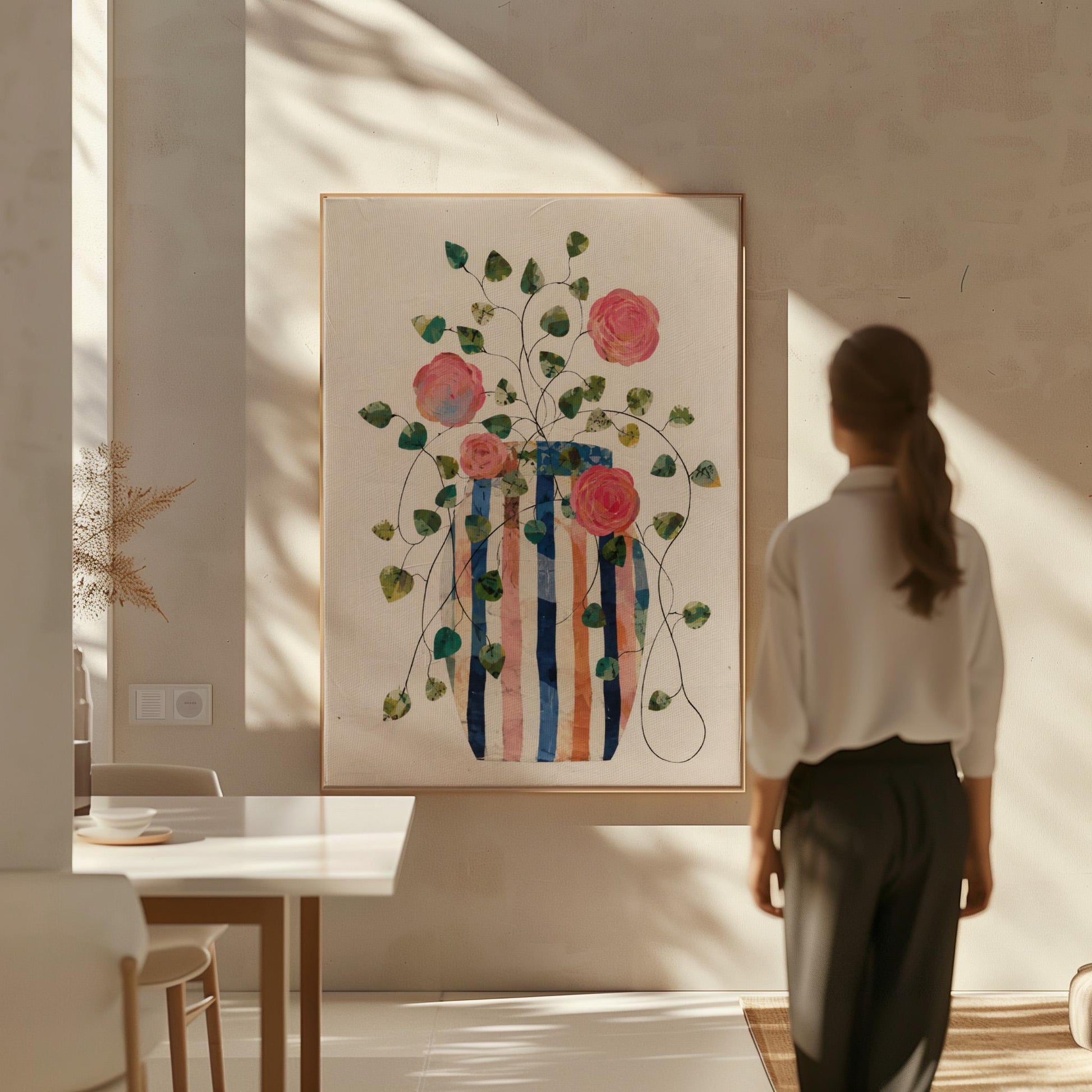 Climbing roses around a striped collage vase, canvas wall art on a quiet wall in a considered interior