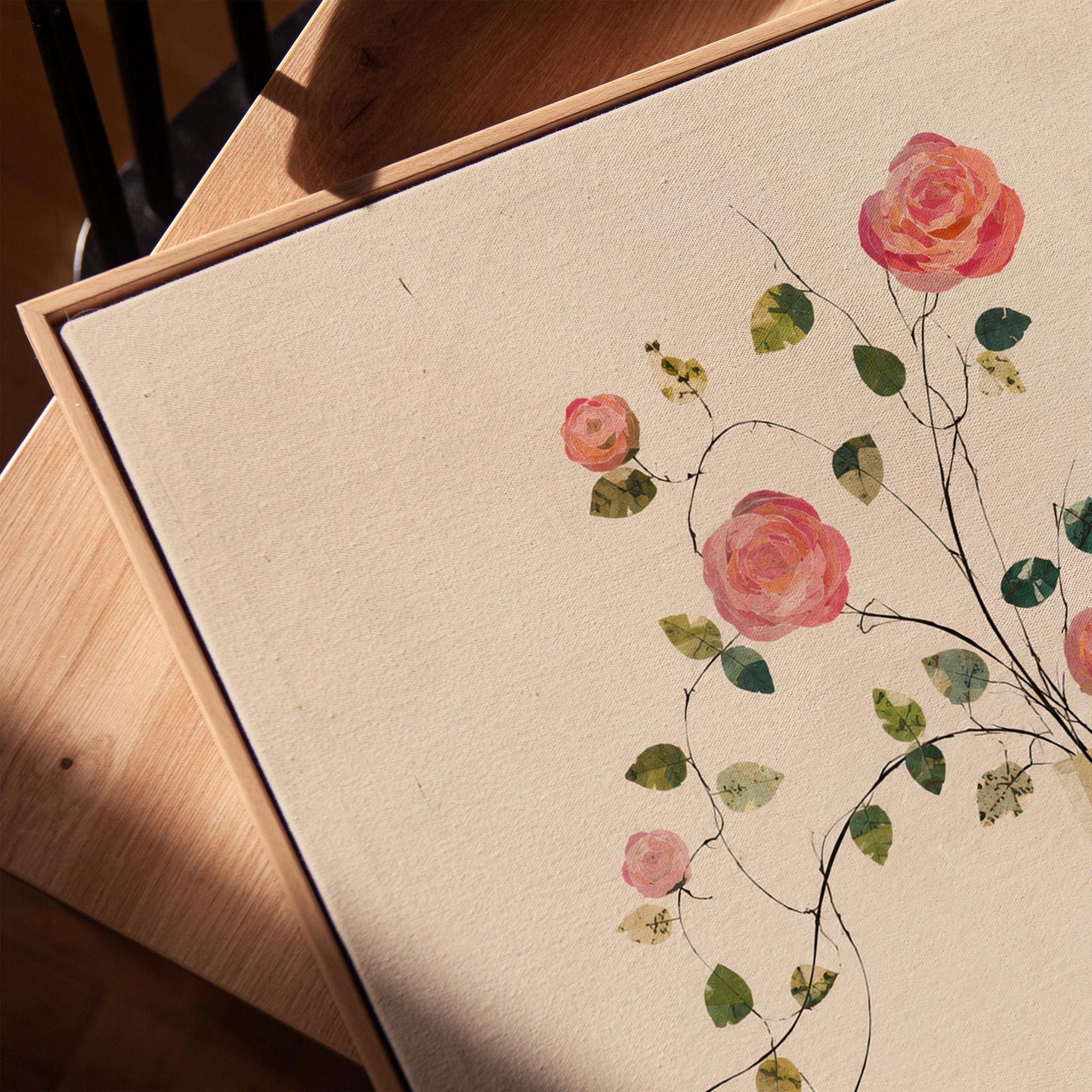 Single rose with trailing vine in slim vase, canvas print in a warm, minimally styled interior