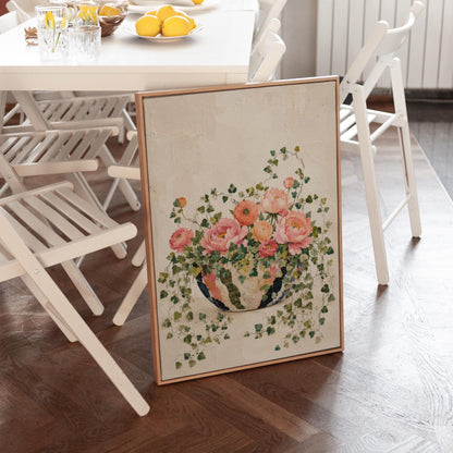 Blush peonies in bowl with cascading ivy, canvas wall art hanging in a calm, modern living space